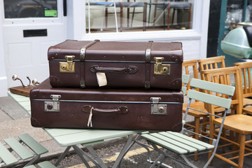 Suitcases near vintage shop at Portobello Market, in Notting Hill district, largest antiques market in UK, famous tourist attractions, on AUG 16, 2015, London, UK.