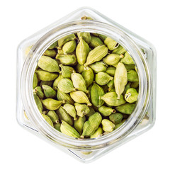 green cardamom pods on white background