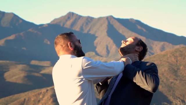 Two businessmen fighting, killing each other in country, super slow motion 240fps
