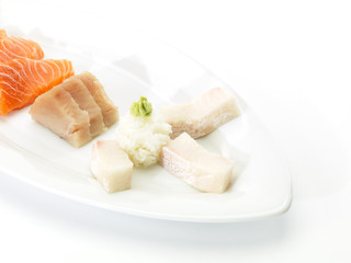 Sliced raw fatty salmon and tuna isolated on white background