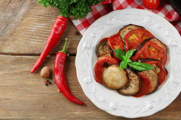 Ratatouille on plate, on table background