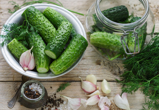 Cucumbers for pickling. Fresh cucumbers ready for canning with dill, garlic and spices.  Selective focus
