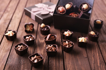 Chocolate sweets on wooden background