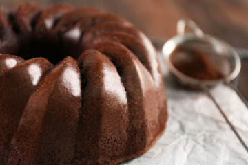 Chocolate cake on paper, closeup
