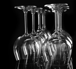 Empty wine glasses on black background, closeup