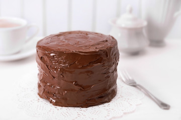 Tasty chocolate cake on light background