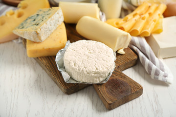 Set of fresh dairy products on white wooden table