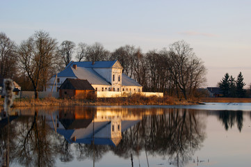 Fototapeta premium Reflection in the water of the manor house Chechot-Bohvitsev (19th century) in the village Podorosk, Belarus.