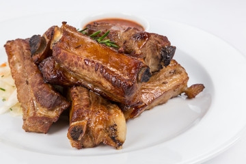 hot smoked barbecue ribs on white plate