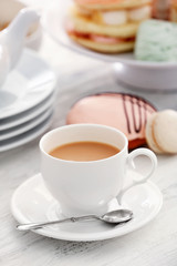 Cake stand with different sweets and tea