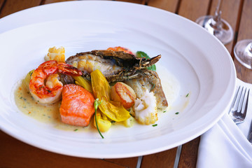 Seafood dish on a wooden table.