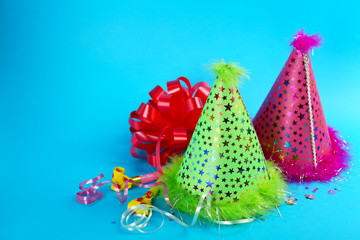 Funny party hats on blue background