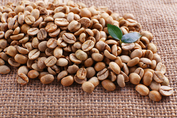 Green coffee beans on sackcloth