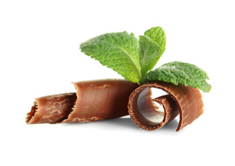 Milk chocolate chips with fresh mint, isolated on white