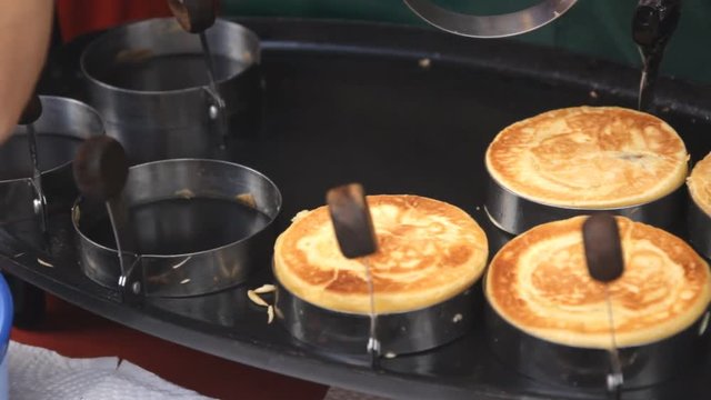 Preparing pancakes on pan