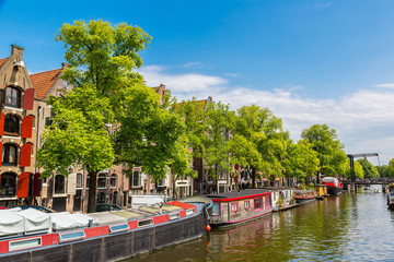 Fototapeta premium Amsterdam canals and boats, Holland, Netherlands.