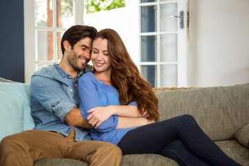 Happy young couple embracing each other