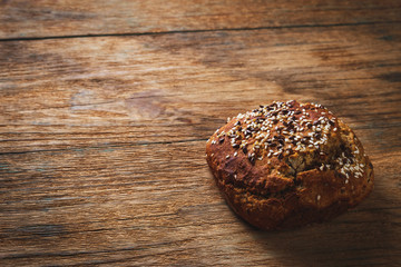 Freshly baked homemade bread on rustic wood background