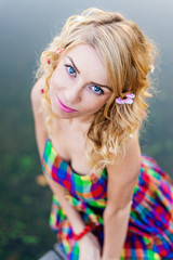 fashion portrait of blonde  girl with magnetic blue eyes