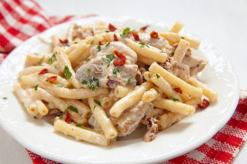 Penne pasta with chicken and cream sauce
