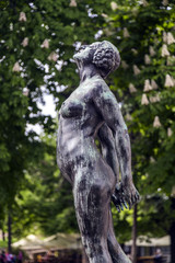 Fototapeta na wymiar A bronze woman statue in Kalemegdan Park, Belgrade, Serbia