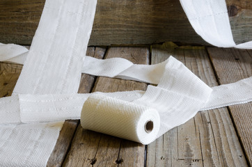 Toilet paper roll on old wooden board