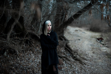 Shot of a gothic woman in a forest.