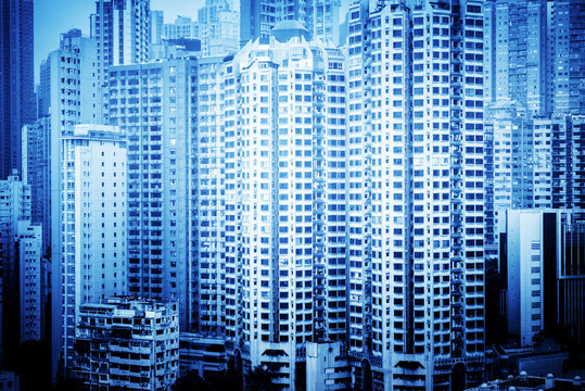 apartments in hongkong,china,blue toned image. © kalafoto