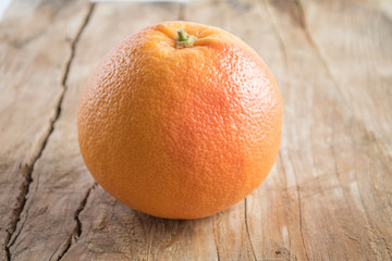 Grapefruit isolated on wooden background