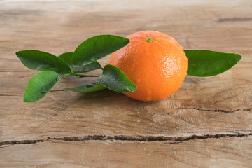 Mandarin orange (tangerine) on wooden background