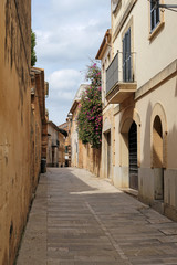 Fototapeta na wymiar one of the charming streets in Alcudia, Majorca, Spain