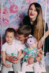 Beautiful family portrait spending time together at studio
