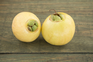 Syzygium Jambos rose apple on wooden background