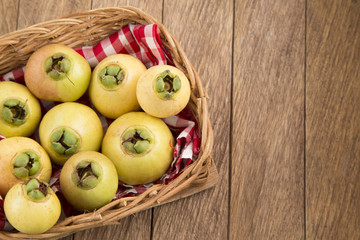 Syzygium Jambos rose apple on wooden background