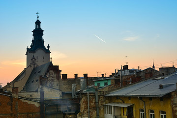 Fototapeta premium Twilight view of medieval Lviv city, Ukraine. Sunset cityscape. Latin Cathedral, the main catholic church of Lviv
