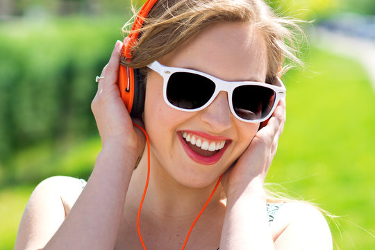 attractive young woman with headphones