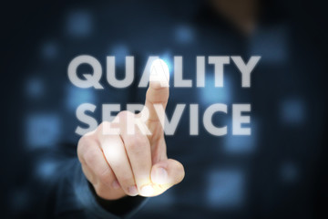 Businessman touching Quality Service