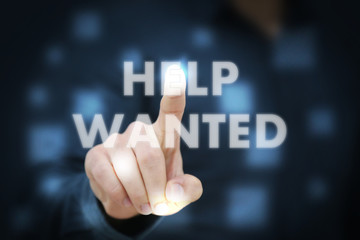 Businessman touching Help Wanted