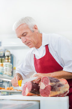 Butcher preparing some meat