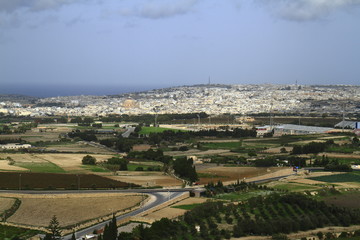 Fototapeta na wymiar Sunny view of fields from tower of Mdina, Malta.