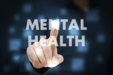 Businessman touching Mental Health