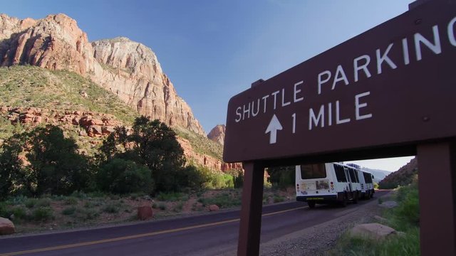 A shuttle makes its way to a shuttle stop in Zion National Park.