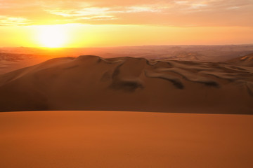 Fototapeta na wymiar Sand dunes near Huacachina at sunset, Ica region, Peru.