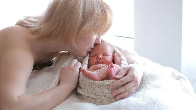 Mom and her Tiny Newborn Baby's. Happy Family concept. Beautiful conceptual video of Maternity.