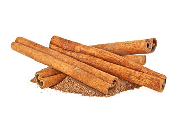 Cinnamon sticks and powder on white background