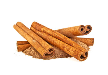 Cinnamon sticks and powder on white background