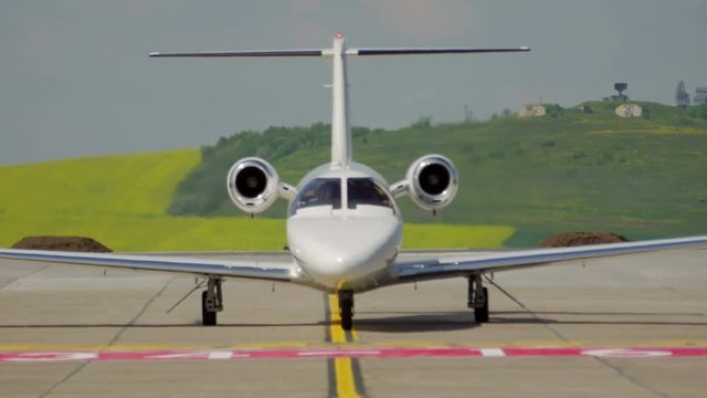 Front side of private jet plane landing at the international airport Danube Delta