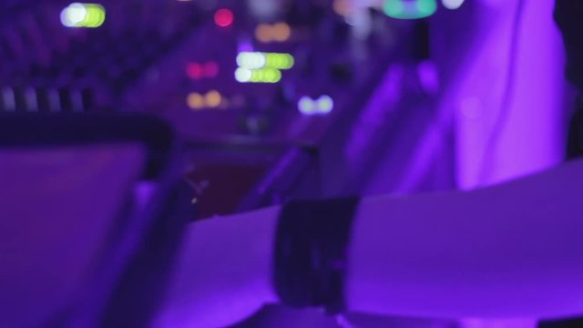 Pile of cd records lying on table, dj performing for audience, party atmosphere