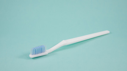 Fototapeta na wymiar The clean white toothbrush for brushing the teeth.