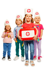 Little doctors with medical box giving first aid